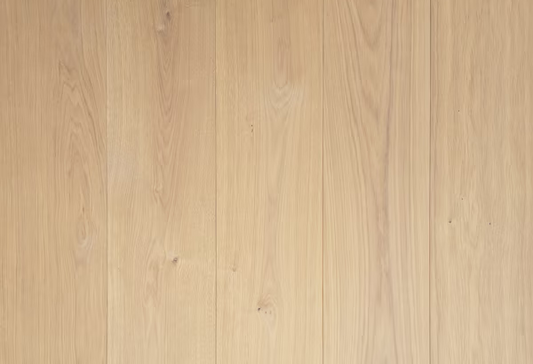 Natural Driftwood flooring in a herringbone pattern, creating a coastal elegance look with the rustic European oak hardwood